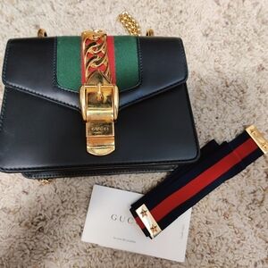 authentic GUCCI Calfskin Mini Sylvie Chain Bag in Black.